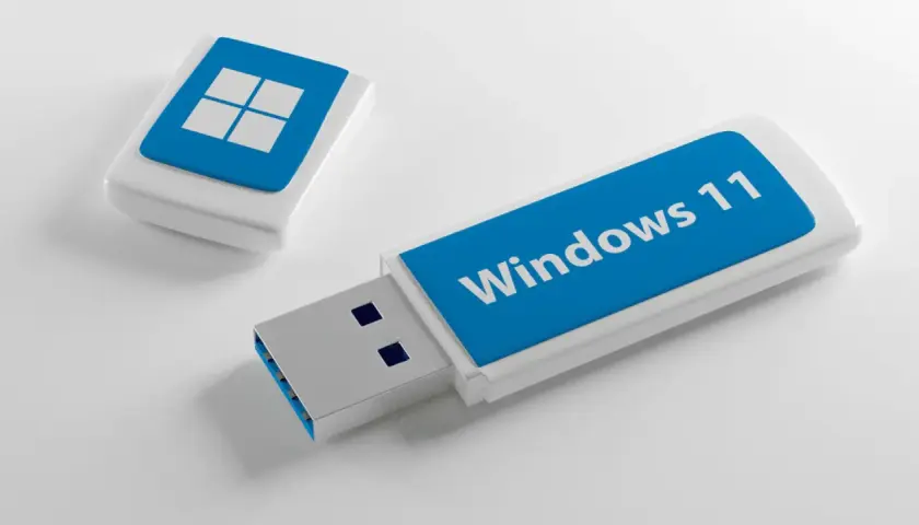 Dwa pendrive'y, jeden z logo Windows 11, drugi z symbolem systemu. Gotowe do instalacji Windows 11.